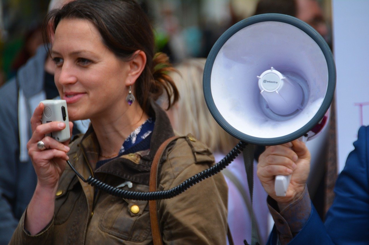 Woman speaking into megaphone