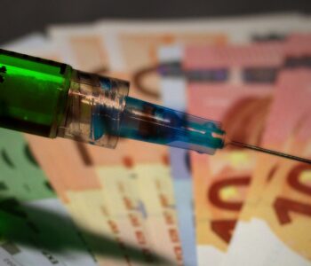 picture of syringe and money