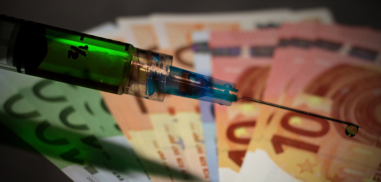 picture of syringe and money