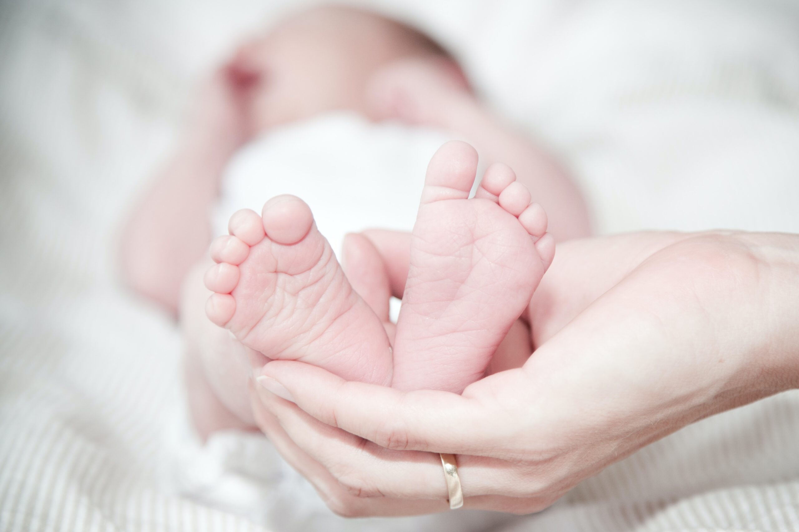 Baby's feet in mother's hands