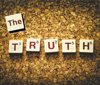 scrabble pieces spell truth